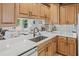 Bright kitchen featuring countertops, sink, and a view of the living room at 4805 E Regnas Ave, Tampa, FL 33617