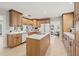 Updated kitchen features custom cabinets, stainless steel appliances, and a center island at 4805 E Regnas Ave, Tampa, FL 33617