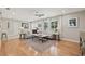 Bright and airy living room featuring hardwood floors, stylish decor, and ample natural light at 4805 E Regnas Ave, Tampa, FL 33617
