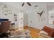 This office features hardwood floors and a decorative steer head with flower accents at 4805 E Regnas Ave, Tampa, FL 33617