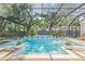 Stunning screened-in pool with a seamless transition from indoor to outdoor living and entertaining at 4805 E Regnas Ave, Tampa, FL 33617