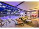 Stunning outdoor space featuring a pool, comfortable seating, and elegant design for luxurious outdoor living and entertainment at 4805 E Regnas Ave, Tampa, FL 33617