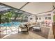Inviting screened-in pool area with comfortable seating, offering a perfect blend of indoor-outdoor living at 4805 E Regnas Ave, Tampa, FL 33617