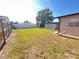 View of the backyard featuring a wooden fence, a shed, and a home on a bright, sunny day at 4812 Bonita Vista Dr, Tampa, FL 33634