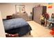 Bedroom featuring tile floors, dresser, and closet organizer at 4812 Bonita Vista Dr, Tampa, FL 33634
