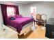 Bedroom featuring a red window valance and door to an en suite bathroom at 4812 Bonita Vista Dr, Tampa, FL 33634