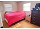 Bedroom showcasing a red bed and dresser at 4812 Bonita Vista Dr, Tampa, FL 33634