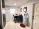 Simple dining area featuring a small table and black chairs, with a water cooler at 4812 Bonita Vista Dr, Tampa, FL 33634