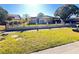 Cozy single-story home featuring a well-maintained lawn and decorative fence at 4812 Bonita Vista Dr, Tampa, FL 33634