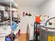 Well-organized storage room with shelves, laundry machine and hot water heater at 4812 Bonita Vista Dr, Tampa, FL 33634