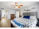 Primary bedroom with a king bed, wood-look flooring, and access to the primary bathroom at 5130 Brittany S Dr # 604, St Petersburg, FL 33715