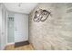 Inviting condo entry with a stone accent wall creating a stylish and welcoming ambiance at 5130 Brittany S Dr # 604, St Petersburg, FL 33715