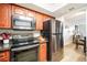 Kitchen featuring stainless steel appliances and wood cabinetry at 5130 Brittany S Dr # 604, St Petersburg, FL 33715