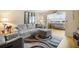 Inviting living room featuring comfortable seating, stylish decor, and water views at 5130 Brittany S Dr # 604, St Petersburg, FL 33715
