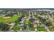 An aerial view displaying the property's location near a park, lake, and golf course at 5340 Denver Ne St, St Petersburg, FL 33703