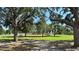 Community ball field for baseball and softball with picnic benches shaded by mature trees at 5340 Denver Ne St, St Petersburg, FL 33703