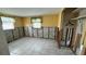 Bedroom undergoing renovations with yellow walls and closet at 5340 Denver Ne St, St Petersburg, FL 33703
