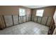 Bedroom with tile flooring undergoing renovations and two windows at 5340 Denver Ne St, St Petersburg, FL 33703