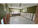 Bedroom with olive green walls and tile flooring being renovated at 5340 Denver Ne St, St Petersburg, FL 33703