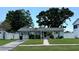 Charming single-story home with a well-maintained lawn, lush landscaping, and a welcoming entrance at 5340 Denver Ne St, St Petersburg, FL 33703