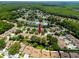 Aerial view of townhouses with mature trees and canal views in a vibrant community at 5524 Salem Square N Dr, Palm Harbor, FL 34685