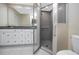 Modern bathroom with a glass-enclosed shower featuring tiled walls and a sleek vanity with storage at 5524 Salem Square N Dr, Palm Harbor, FL 34685