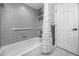 Tiled bathroom features a shower/tub, and a shower door at 5524 Salem Square N Dr, Palm Harbor, FL 34685