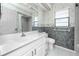Bright bathroom features a large mirror, vanity, sink, toilet, and shower at 5524 Salem Square N Dr, Palm Harbor, FL 34685