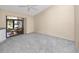 Bright bedroom featuring a sliding glass door to the lanai, carpet and ceiling fan at 5524 Salem Square N Dr, Palm Harbor, FL 34685