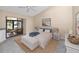 Bright bedroom with sliding glass door to lanai, ceiling fan, and neutral colors at 5524 Salem Square N Dr, Palm Harbor, FL 34685