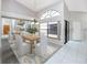 Formal dining room with high ceilings, large windows, and modern decor at 5524 Salem Square N Dr, Palm Harbor, FL 34685