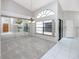 Formal dining room featuring modern lighting, large window and sliding glass doors at 5524 Salem Square N Dr, Palm Harbor, FL 34685