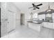 Eat-in kitchen features tiled floors, an island, and decorative wallpaper at 5524 Salem Square N Dr, Palm Harbor, FL 34685