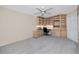 Carpeted office featuring built-in shelving and a large window at 5524 Salem Square N Dr, Palm Harbor, FL 34685