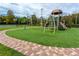 A playground offers a safe and fun environment for children, complete with soft turf and diverse play structures at 5524 Salem Square N Dr, Palm Harbor, FL 34685