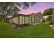 Enclosed sunroom featuring abundant natural light, extending indoor living space outdoors at 5524 Salem Square N Dr, Palm Harbor, FL 34685