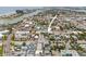 Aerial view showing a community pool and a mix of residential properties nearby at 600 71St Ave # 18, St Pete Beach, FL 33706