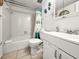 Clean, bright bathroom with tub and shower combination and white vanity at 600 71St Ave # 18, St Pete Beach, FL 33706