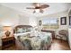 Relaxing bedroom features tropical decor, a ceiling fan, and plenty of natural light at 600 71St Ave # 18, St Pete Beach, FL 33706
