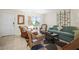 A cozy living room featuring wicker furniture and a large window for natural light at 600 71St Ave # 18, St Pete Beach, FL 33706