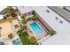 Aerial view of community pool and loungers; great for relaxing and enjoying the sun at 600 71St Ave # 18, St Pete Beach, FL 33706