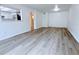 Bright living room featuring wood-look floors and neutral walls at 6206 Dewdrop Way # 0, Temple Terrace, FL 33617