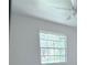 A window in a white room showing green leafy trees outside in a natural outdoor setting at 6206 Dewdrop Way # 0, Temple Terrace, FL 33617