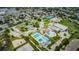 Aerial view of the Recreation & Aquatic Center with pools, tennis courts, and green spaces at 6406 Congress St, New Port Richey, FL 34653