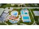 Aerial view showcases the Aquatic Center's pools and amenities, ideal for Gathering fun at 6406 Congress St, New Port Richey, FL 34653