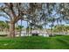 Picturesque wooden bridge with white railings crossing a serene lake surrounded by lush greenery at 6406 Congress St, New Port Richey, FL 34653