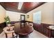 Well-lit conference room with a large table, wood trim, and comfortable chairs at 6406 Congress St, New Port Richey, FL 34653