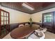Bright conference room featuring a long table, wood-paneled walls, and ample lighting at 6406 Congress St, New Port Richey, FL 34653