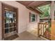 Close-up of a covered front porch with wood detail and inviting entrance at 6406 Congress St, New Port Richey, FL 34653