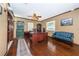 Spacious office with hardwood floors, built-in bookcases, and a large desk at 6406 Congress St, New Port Richey, FL 34653